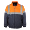 Casaco impermeável com forro polar e detalhes em 2 tons refletores (laranja/azul ou amarelo/azul).